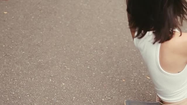 Woman Walking in Dress With Rose