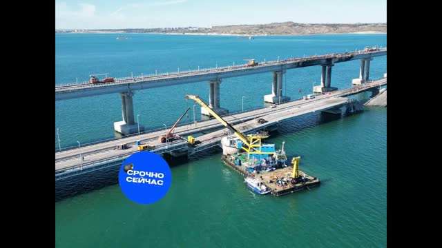 Section of Kerch Bridge fallen off its bearings lifted back by a floating crane.(12-10-22)