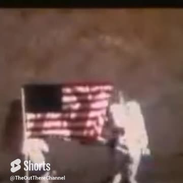 Spacemen on wires on the moon is clear reflection as he turns and leans right