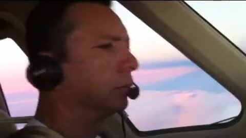 Plane flying above the sunrise and clouds?