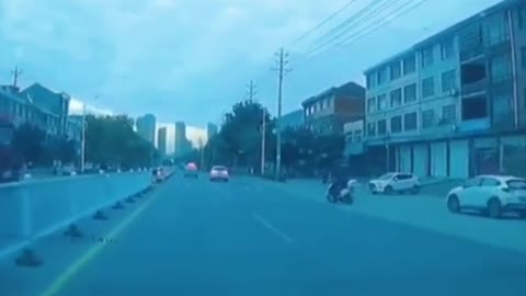 The old Chinese man was hit by a car while crossing the road