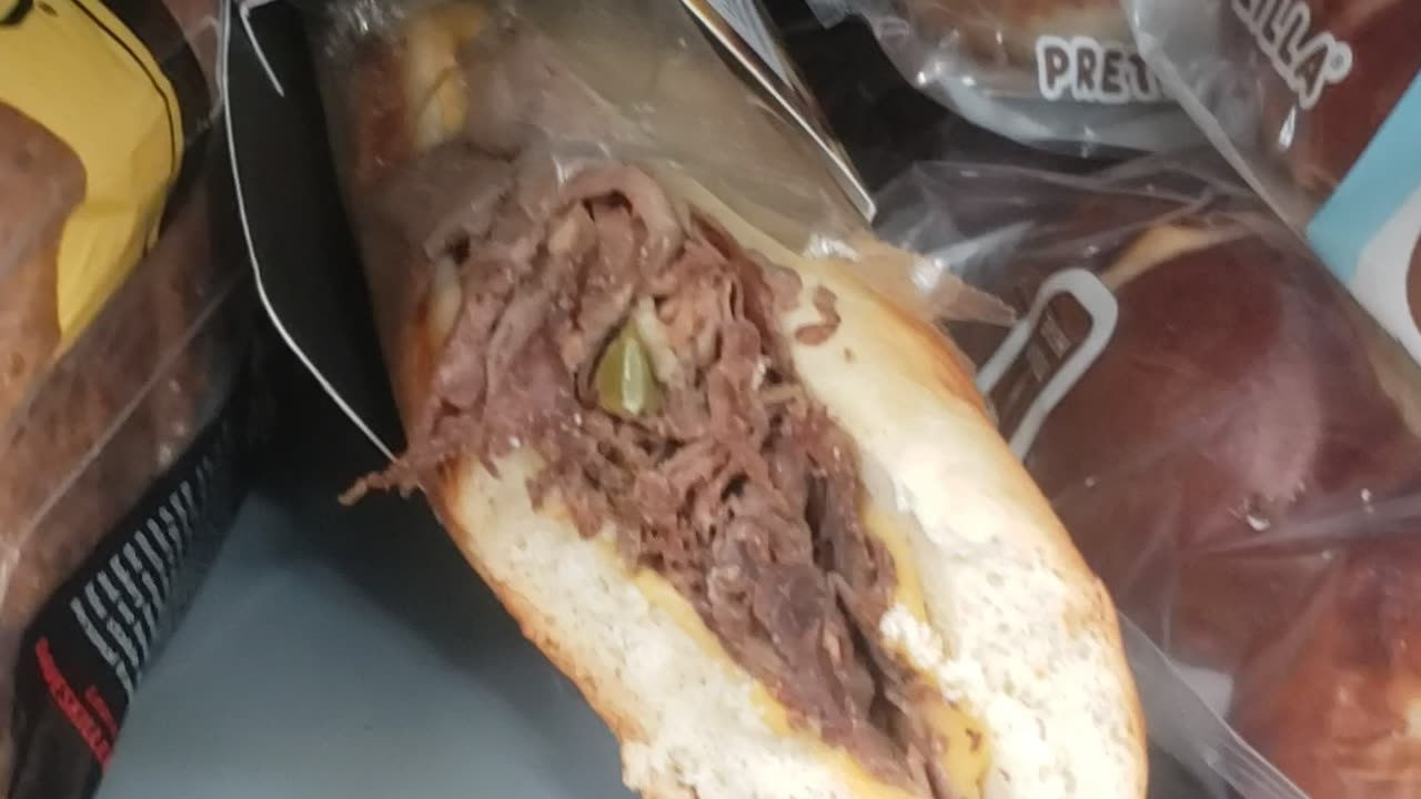 Shopping for bread at walmart found an half eaten sandwich