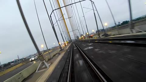 Belgrade tram surf across bridge