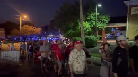 line of Trump supporters wraps around the block