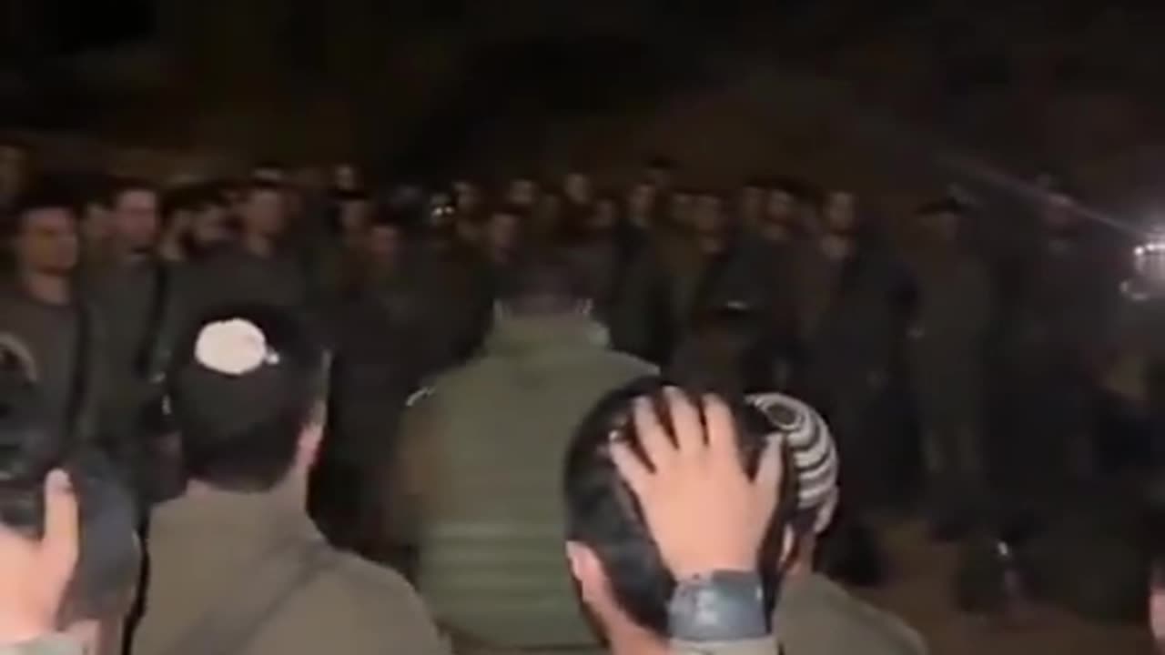 Soldiers from the Golani Brigade circle in Prayer before entering Lebanon