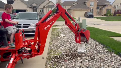 Grandson practicing with Kubota Backhoe