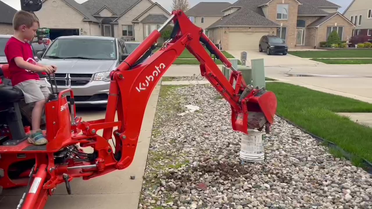 Grandson practicing with Kubota Backhoe