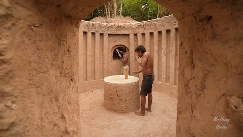 Building underground hut with grass roof & fireplace with clay.