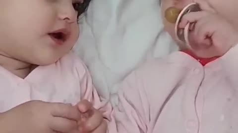 Two cute babies in cute naughty