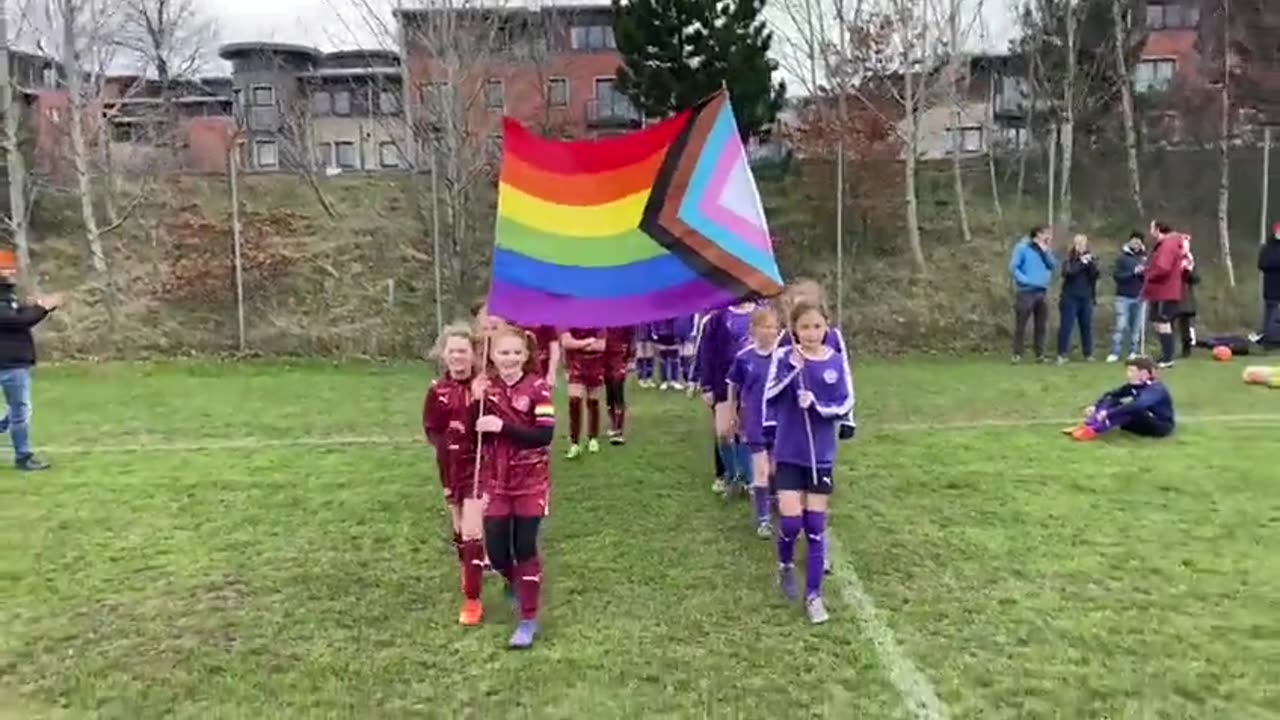 Two Children Sports Teams Forced to Carry LGBT/Ukraine Flag for Virtue Signal Points