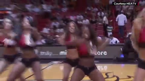 Cheerleader drops phone; dolphin brings it back_Cut