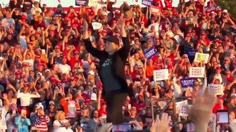 Donald Trump and Elon Musk dance at a campaign rally