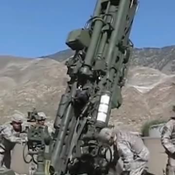 American soldiers firing artillery