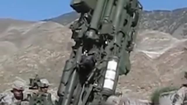 American soldiers firing artillery