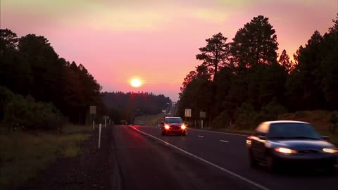 car passing by at sunset