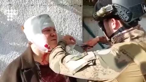 Members of Nazi aligned Azov battalion patching up citizens allegedly caught up in missile strikes