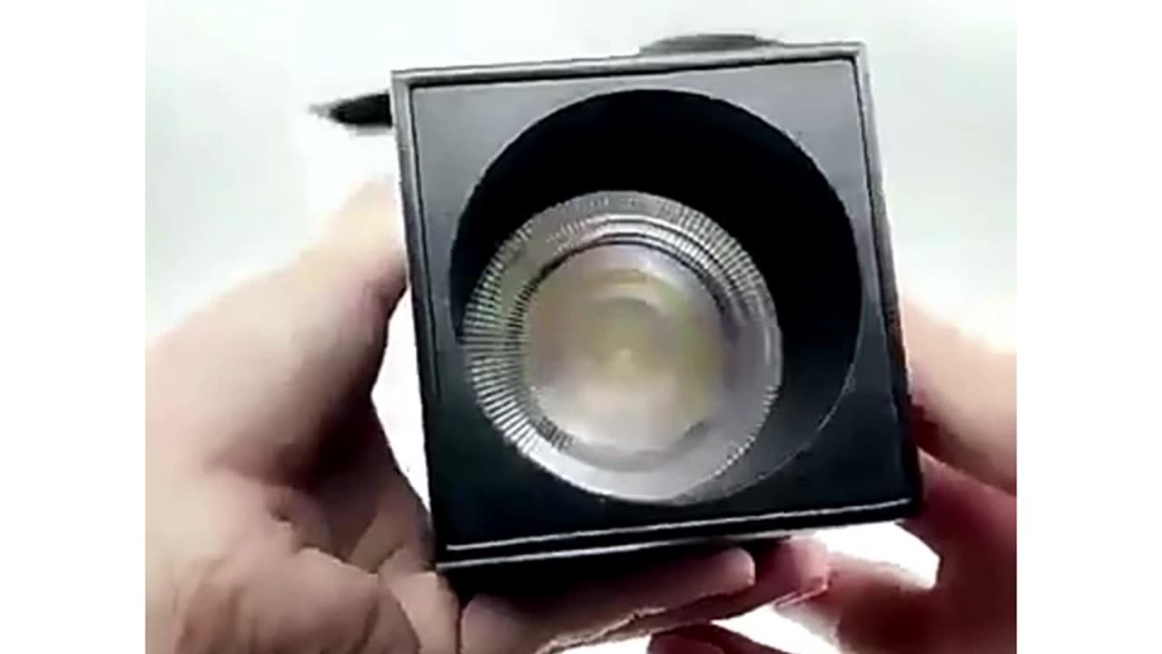 Surface mounted folding spotlight