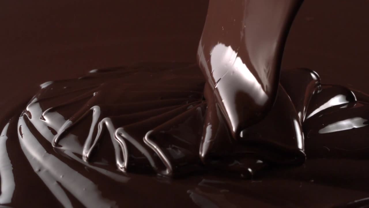 Chocolate falling all over creamy yummy! [Free Stock Video Footage Clips]