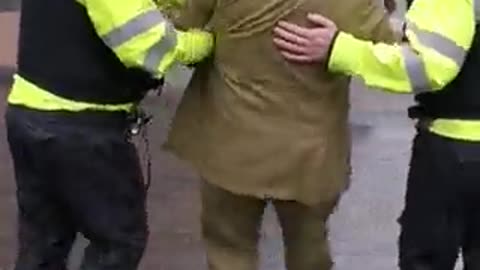 British police officers detain elderly man dressed in a suit to ‘prevent potential breach of peace’