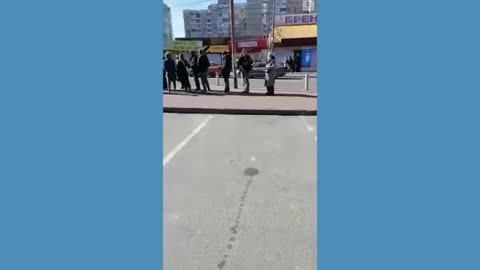 Kyiv residents wait for food at grocery stores