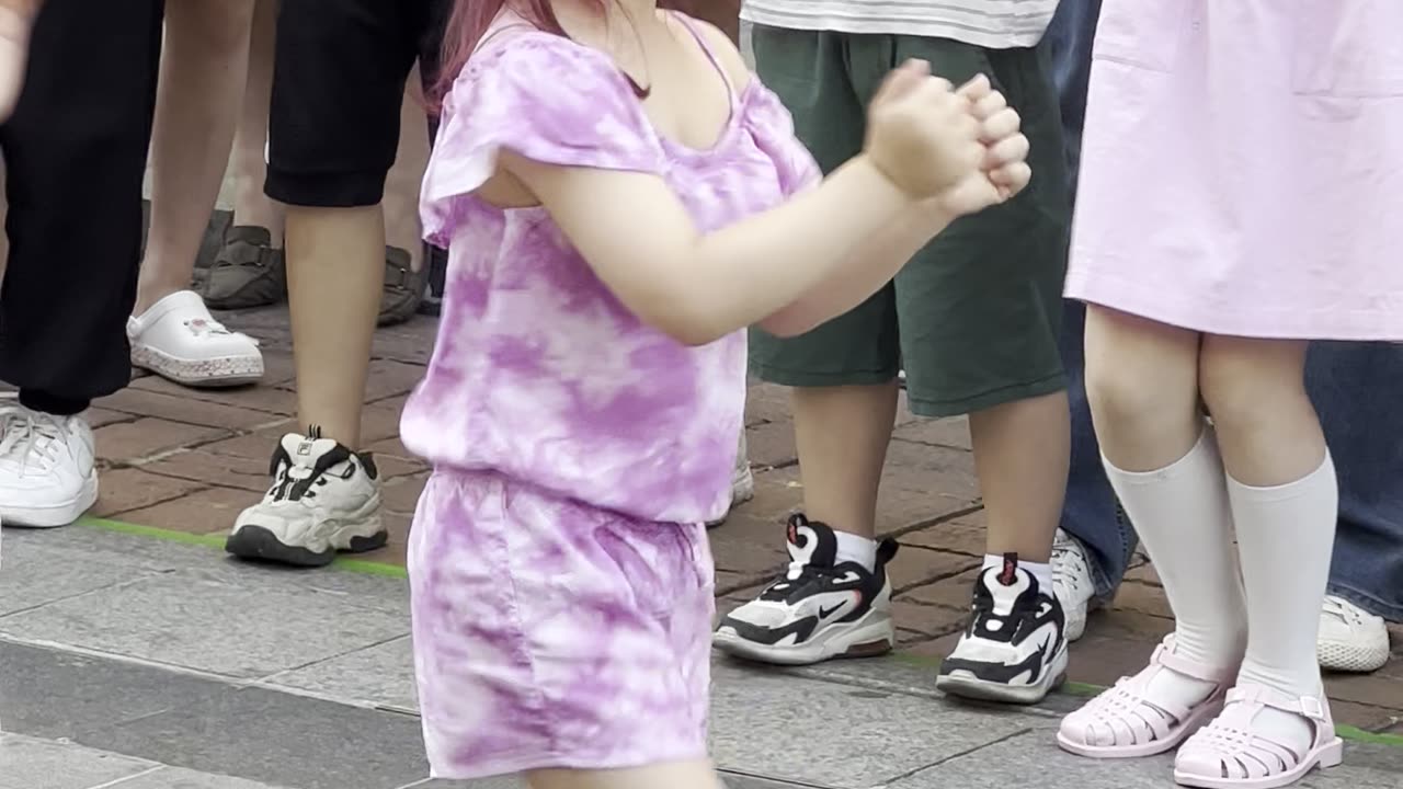 Korean cute little girl performing K-pop dance