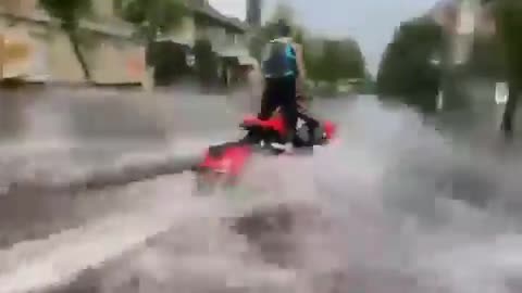 Guy Rides his Jet Ski on Flooded Streets of Ukraine After Heavy Rainfall