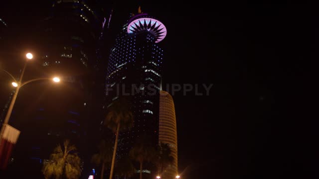 City skyscrapers are lit up against the night sky