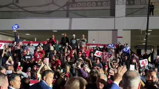 President Donald J. Trump walks off stage in Michigan to greet his supporters.