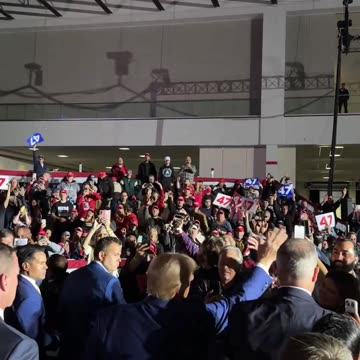 President Donald J. Trump walks off stage in Michigan to greet his supporters.