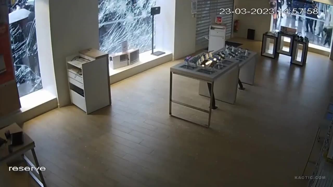 A demonstration in France seen from inside a telephone store