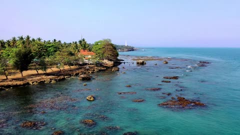 A picturesque island on the shore of the ocean .