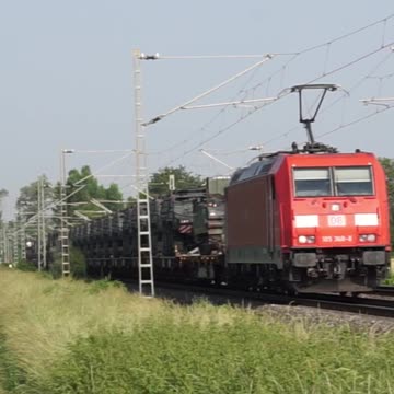 DB Cargo AG with 185 368-8 pulls a military train