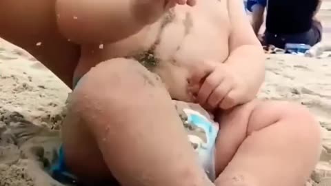 Funny baby reaction to the beach