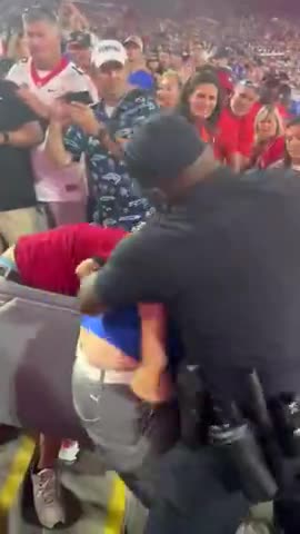 The Police Having Some Brawl Fun at the Stadium.mp4