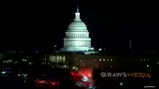 In Washington, DC, fire brigade and ambulances outside the Capitol building with sirens on
