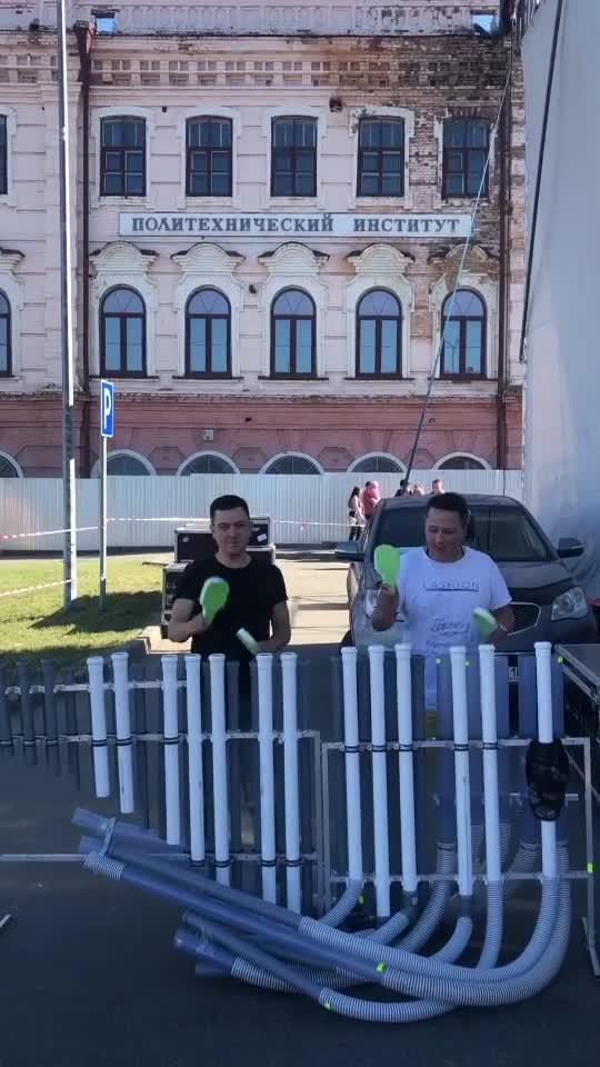 playing pvc instrument in the inner city of Sarapul