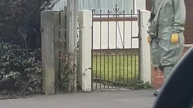 Man Heads out for a Walk in a Hazmat Suit