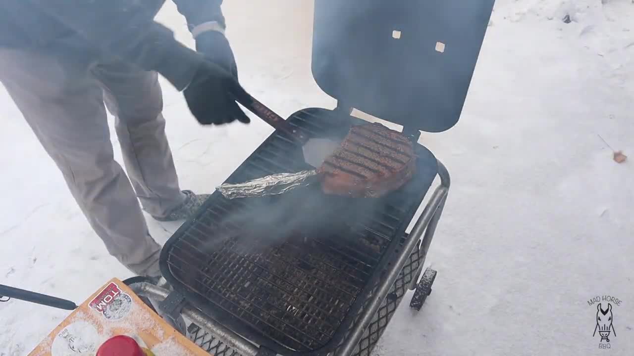 Huge Tomahawk Ribeye Cooked On A Charcoal Grill |