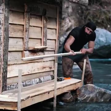 He built a cozy shelter above water so he could fish from it 🪵 🎣