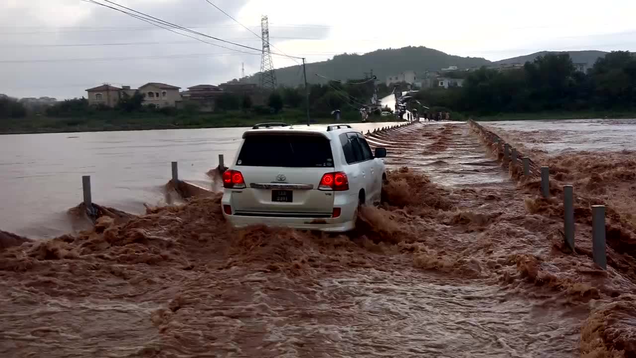 Crossing a Flooded River in a Toyota