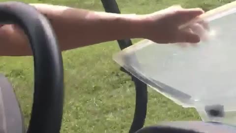 Golfer black shirt hit by golf cart breaks windshield angle 1