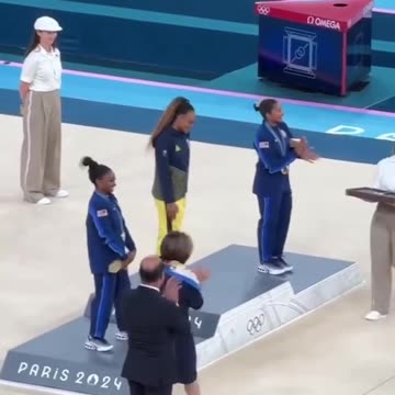 Simone Biles and Jordan Chiles bow down to Rebeca Andrade on podium