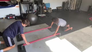 Exercise Technique #17 Bodyweight: staggered push-up on balance bars