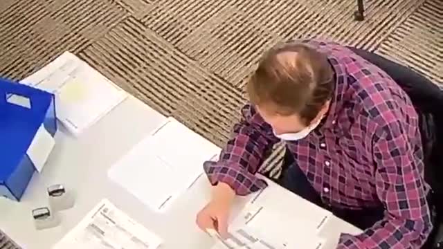 PA Poll Worker fills out ballots