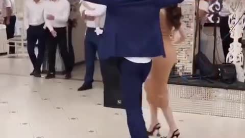 The Girl Is Elegantly Affectionately Dancing At The Wedding With The Guys