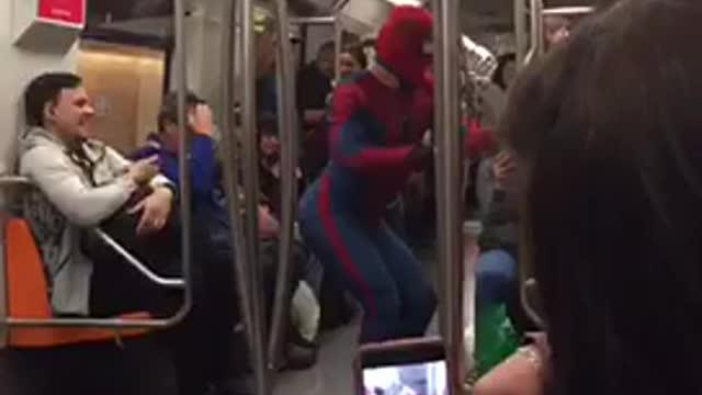 Spiderman costume guy does flips and dances in subway