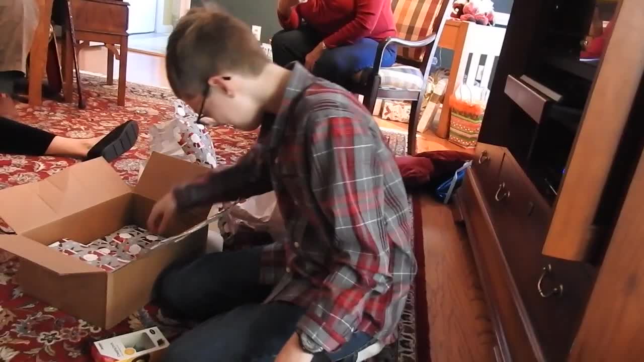 Child Cries Tears of Joy over Gaming Console for Christmas