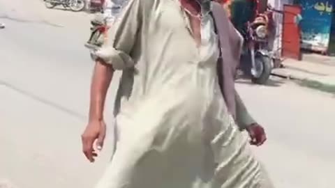 Mad Man Dancing on Road