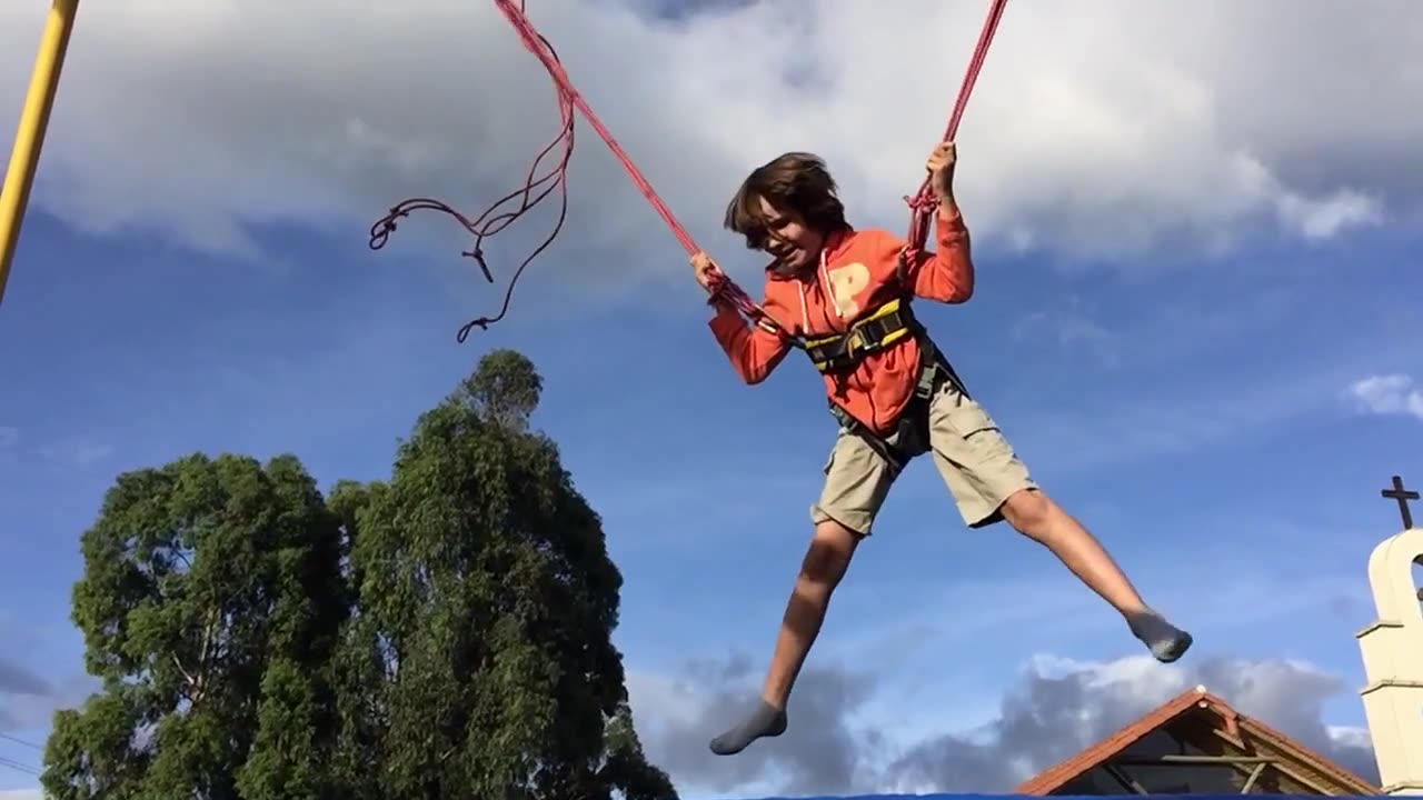 Kid jumping on trampoline