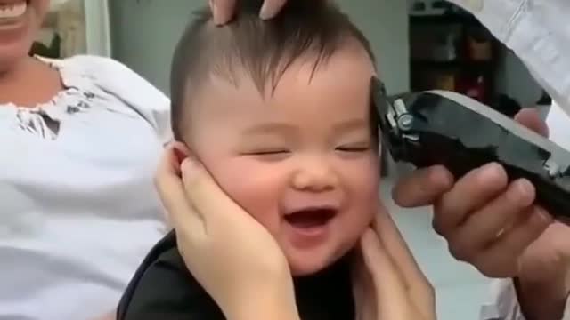 Baby's cute reaction to cutting his hair